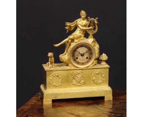 A French Empire ormolu mantle clock, the 7cm circular engine turned dial with Roman numerals, twin winding holes, eight day m