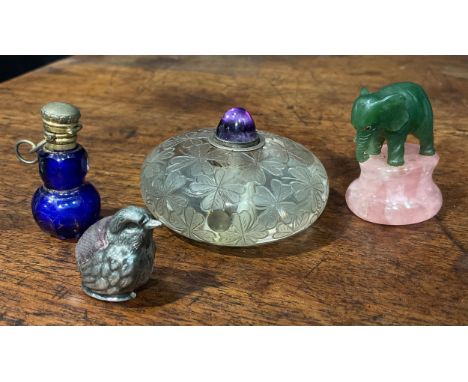 A Japanese rock crystal bell push, decorated with shamrocks, 5cm in diameter; a Jade Elephant, rose quartz base 3.5cm; a silv