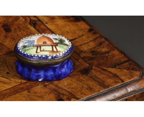 A George III Bilston enamel oval patch box, the cover decorated with a bee hive within a pearled border, 'An Emblem of Indust