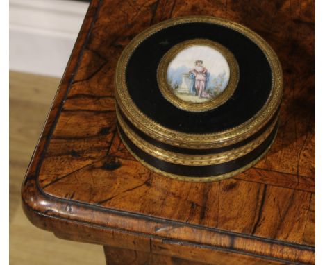 A 19th century gilt metal mounted tortoiseshell lined circular table snuff box, push-fitting cover centered by an oval reserv