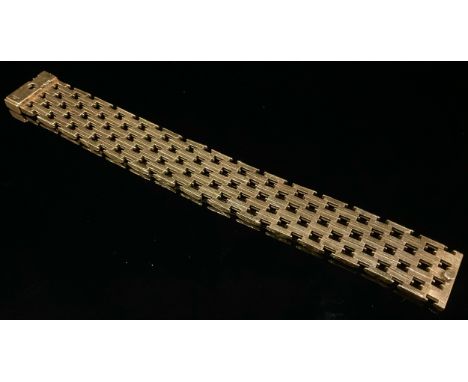 A 9ct gold pierced brick link bracelet, each textured panel divided by burnished strap, 19cm long, approximately 43.8g 