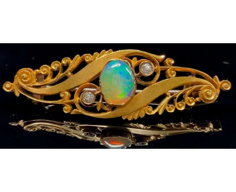 A Victorian diamond, opal and 15ct gold brooch, the central oval cabochon flanked by two round brilliant cut diamonds within 