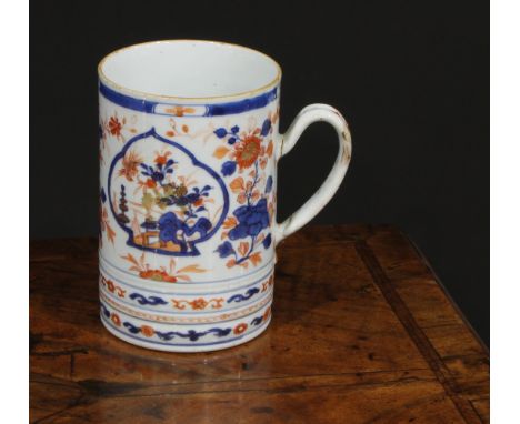 A Chinese export porcelain cylindrical mug, painted in the Imari palette and picked out in gilt, scroll handle, 15.5cm high, 