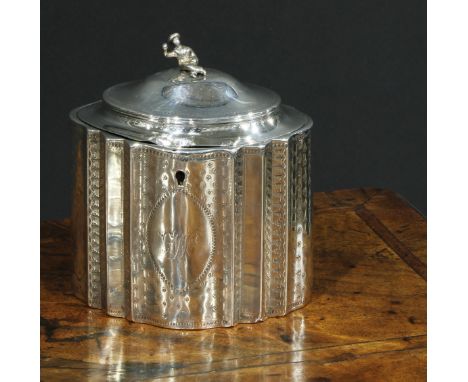 A George III silver commode shaped tea caddy, hingedc domed cover with chinoiserie finial, bright-cut engraved, 13cm wide, Ro