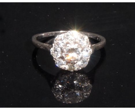 A diamond cluster ring, central old brilliant cut diamond approx 0.50ct surrounded by eight smaller conforming diamonds, tota