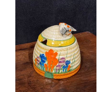A Clarice Cliff Bizarre Blue Crocus pattern ribbed honey pot and cover, the moulded basketweave cover with bee knop, 7cm high