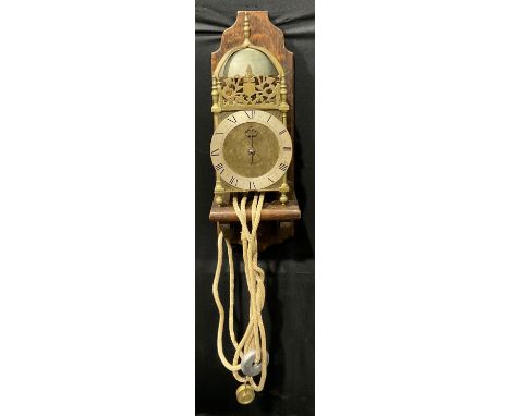 A 19th century brass lantern clock, silvered chapter ring inscribed with Roman numerals, eight day movement with anchor escap