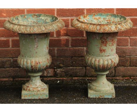 A pair of 19th century cast iron campana shaped garden urns, egg-and-dart rims, 55.5cm high, 44cm diameter