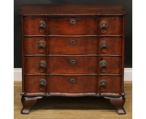 An 18th century Dutch oak arc-en-arbalète chest or commode, slightly oversailing top with moulded edge above four long drawer