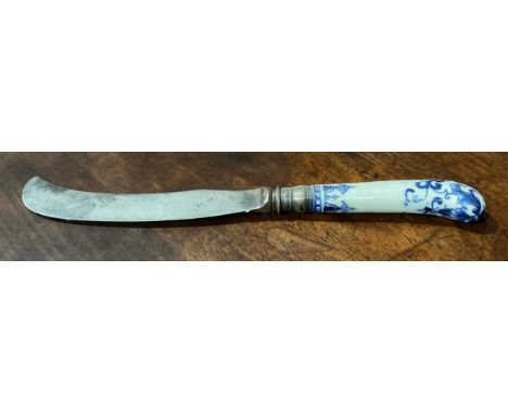 A Saint Cloud porcelain knife handle, pistol grip, painted in underglaze blue with scrolls, steel knife blade, 21.5cm long ov