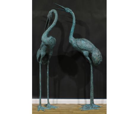 A pair of substantial contemporary copper alloy garden models, as waterbirds, the largest 247cm high, the other 227cm high 
