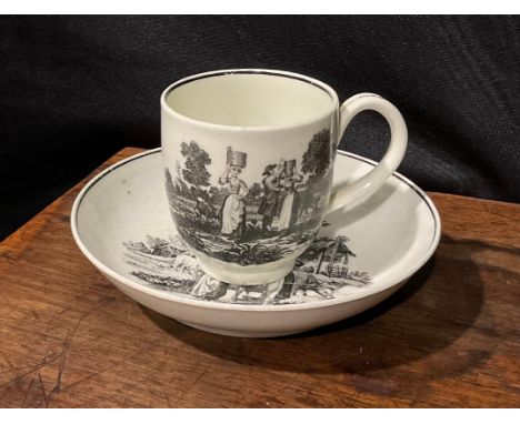 A Worcester Milkmaids and Cow Herder pattern coffee cup and saucer, printed in monochrome after Robert Hancock, c.1770 