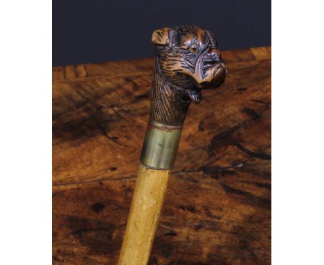 A late 19th century novelty automaton walking stick, the Black Forest type pommel carved as the head of a dog, with articulat