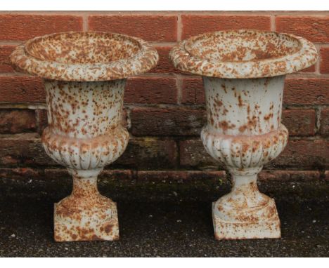 A pair of 19th century cast iron campana shaped garden urns, egg-and-dart rims, 43cm high, 33cm diameter