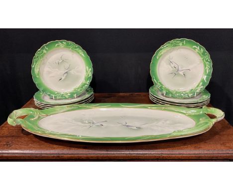 A Royal Worcester fish service for ten, painted by James Hadley, comprising shaped circular plate and a two handled oval plat
