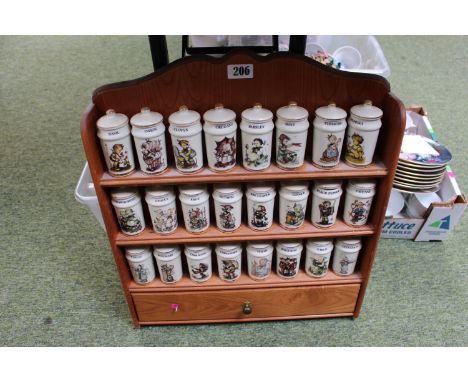M J Hummel collection of Spices on fitted rack 