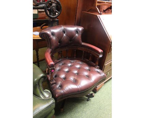 Maroon button back Swivel office chair on swivel base 