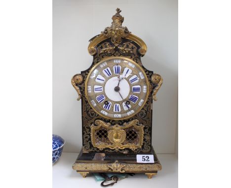 Late 19thC French Boulle mantel clock, The ormolu mounted arched case with all-over brass inlaid tortoiseshell, plinth base w