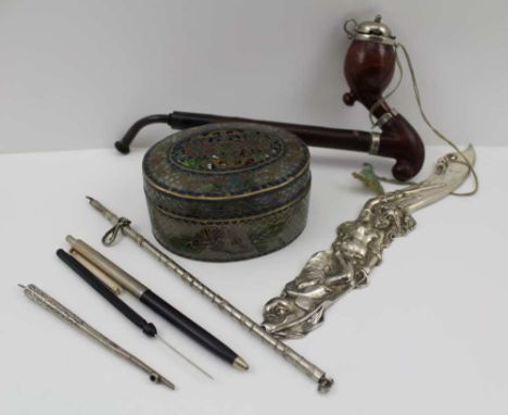 AN OVAL PIQUE WARE BOX &amp; COVER, 9cm, together with; a silvered letter opener cast with a mermaid handle, a German Bruyere