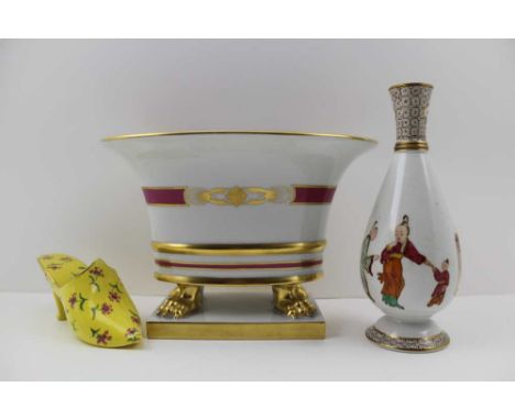 A 'HEREND' HAND-PAINTED AND GILDED OVAL PORCELAIN VASE, raised on four gilded paw feet on a platform base, printed 'Herend Hu