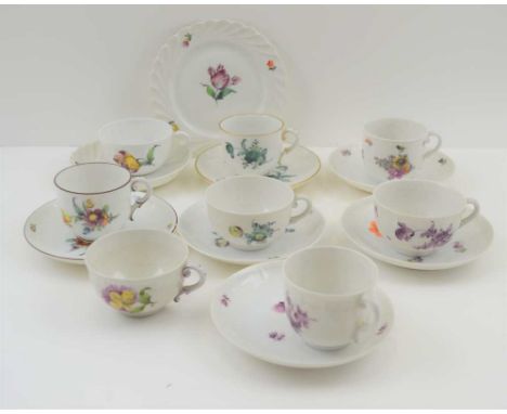 A COLLECTION OF 20TH CENTURY NYMPHENBURG PORCELAIN COFFEE CUPS &amp; SAUCERS, varying floral designs, comprising one trio, al