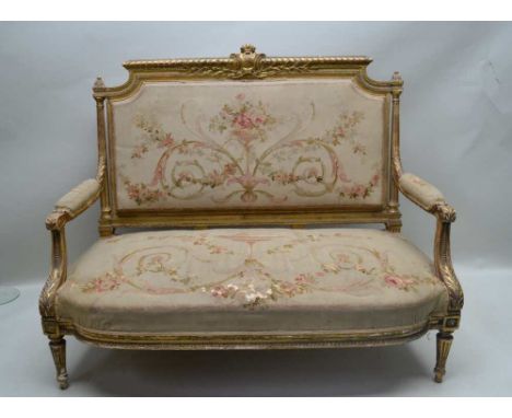 A FRENCH LOUIS XVI STYLE CANAPE SOFA, gilt gesso open arm frame, crested back, acanthus leaf scroll terminal arms, fluted tap