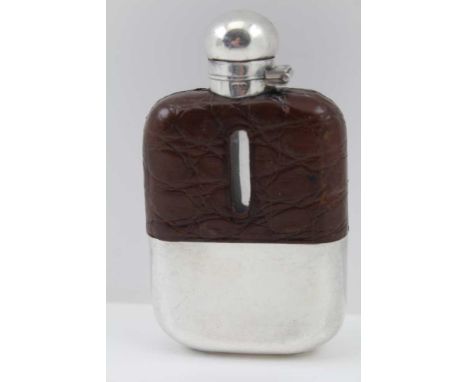 A JAMES DIXON AND SONS HIP FLASK having silver-plated removable cup base, crocodile leather covered shoulders, 10.5cm high 