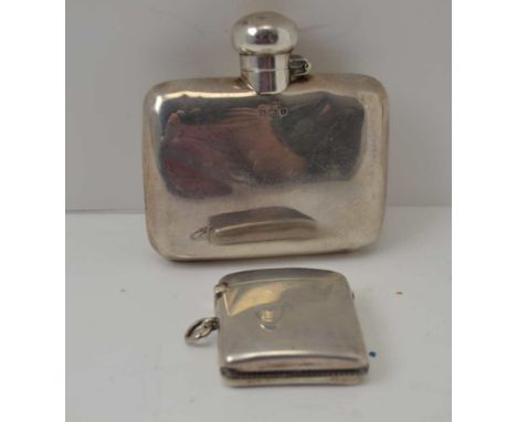 A SILVER HIP FLASK, with hinged twist cover, Birmingham 1922, together with a SILVER VESTA CASE, fitted suspension ring, Birm