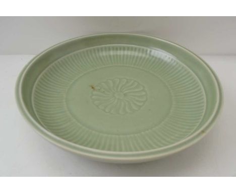 A CHINESE CELADON CERAMIC SHALLOW BOWL, incised floral central decoration, 26.5cm in diameter, bears blue under glaze, charac