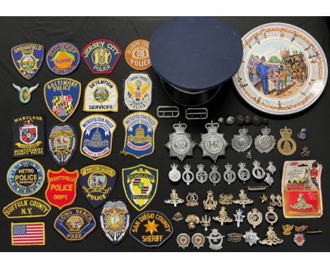 A collection of Queens Crown Police Helmet Plates and cap badges and one Kings Crown Stoke on Trent City Police cap badge, Ki