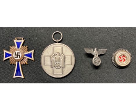 WW2 Third Reich Awards and insignia collection to include: Ehrenkreuz der Deutsche Mutter Dritte Stufe - Mother's Cross 3rd C