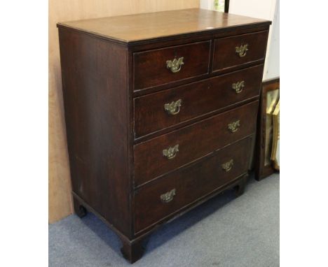 A 19th century oak chest fitted two short &amp; three long graduated drawers with brass swing handles, &amp; on bracket feet,