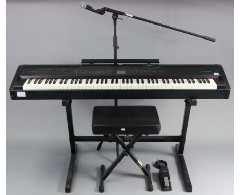 A Roland “FP-80” digital piano with travelling case, stool, &amp; various other accessories&nbsp;including an 'M-Audio' audio