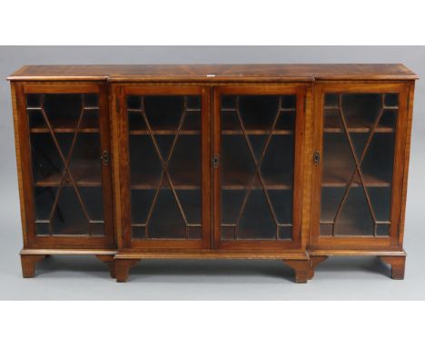 A Bevan Funnell of Brighton reproduction mahogany dwarf break-front cabinet fitted six shelves enclosed by two pairs of glaze