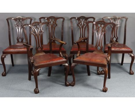 A set of six mahogany Chippendale-style mahogany dining chairs (including a pair of carvers) with pierced splat backs, padded
