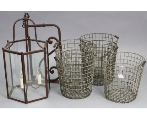 A metal-frame pendant hall lantern of six-sided form, 14½” wide x 25½” high with bracket; &amp; five French wire-work baskets