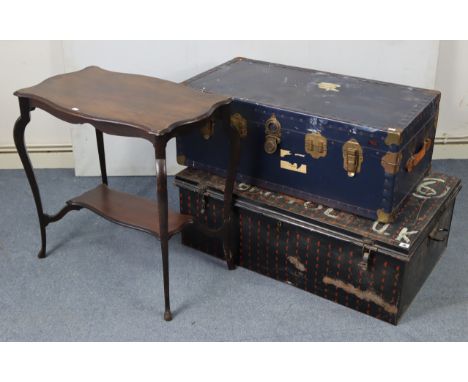 A black japanned-metal travelling trunk with hinged lift-lid &amp; with wrought-iron side handles, 38½” wide x 13” high x 24½