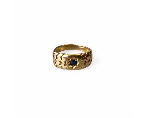 A Men's 18ct yellow gold gypsy ring with central sapphire  Ring size: S Approximately  Weight: 8g Approximately  Unmarked but