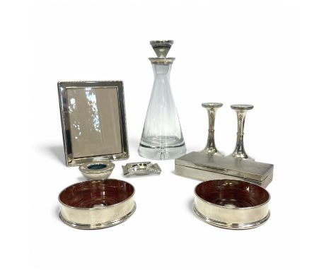 A collection of silver items, to include a silver mounted "Pyramid" decanter by Broadway & Co, a pair of candlesticks by the 