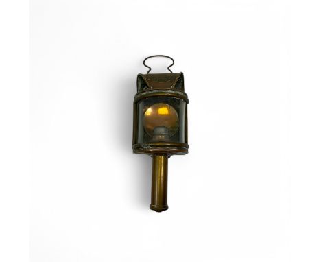 A Shand Mason & Co copper and brass fire engine lamp, with a swing handle over a brass plaque inscribed Shand Mason & Co, Fir