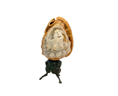 An early 20th century cameo conch lamp, carved with a classical scene depicting Cupid and Psyche within a cartouche surrounde