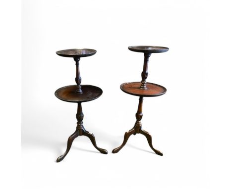 A pair of George III style mahogany two tier dumb waiters on splayed tripod bases, 37cm diameter, 86cm high.