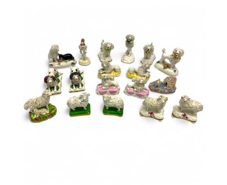 A collection of miniature English porcelain dogs and sheep, including a pair of Rockingham porcelain poodles each lying with 