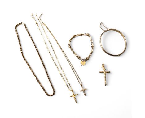 A collection of 9ct yellow gold jewellery.  A 9ct yellow gold gate bracelet with heart clasp, a 9ct yellow gold crucifix, a 9