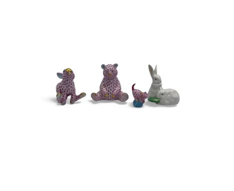 Herend porcelain animals, comprising a bear, a hare and a kitten in red fishnet, together with a figure group of two rabbits 
