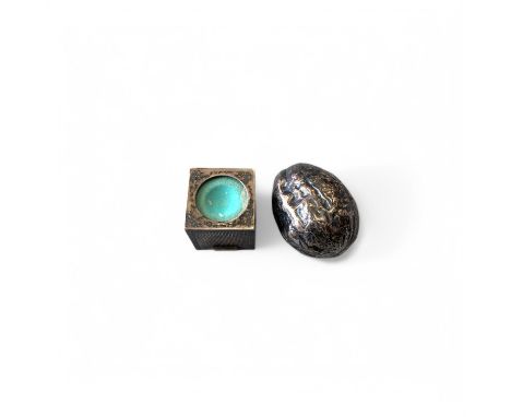 A continental silver sculpture of a walnut, with wooden stand, together with an engine turned silver cue chalk holder (2)