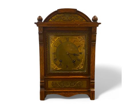 An Oak 8 day striking Mantle clock, striking on two gongs 27cm by 19cm by 39cm high. Running, restoration to case top.