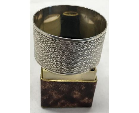 A STERLING SILVER NAPKIN RING IN BOX