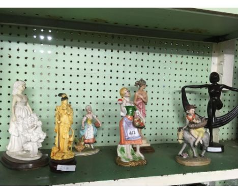 SHELF OF VARIOUS FIGURINES OF LADIES