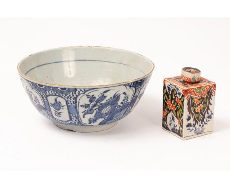A Dutch Delft blue and white bowl painted with flowers and a square section tea caddy painted red, black and green, early 19t